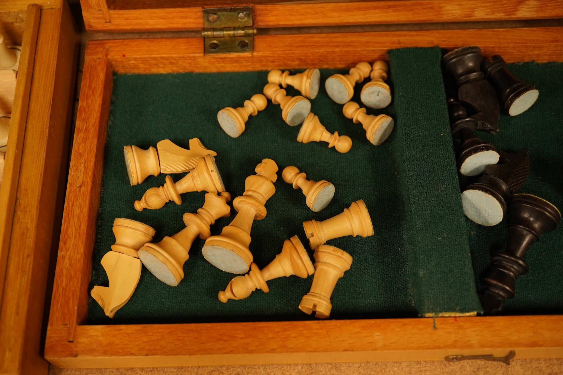 Two boxed chess sets, a cricket ball and a bird scaring rattle, largest chess set 32cm wide x 9cm high x 20cm deep.